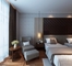 カスタマイズされたホテルの寝室の家具はクルミのベニヤのベッドE1の合板を置く